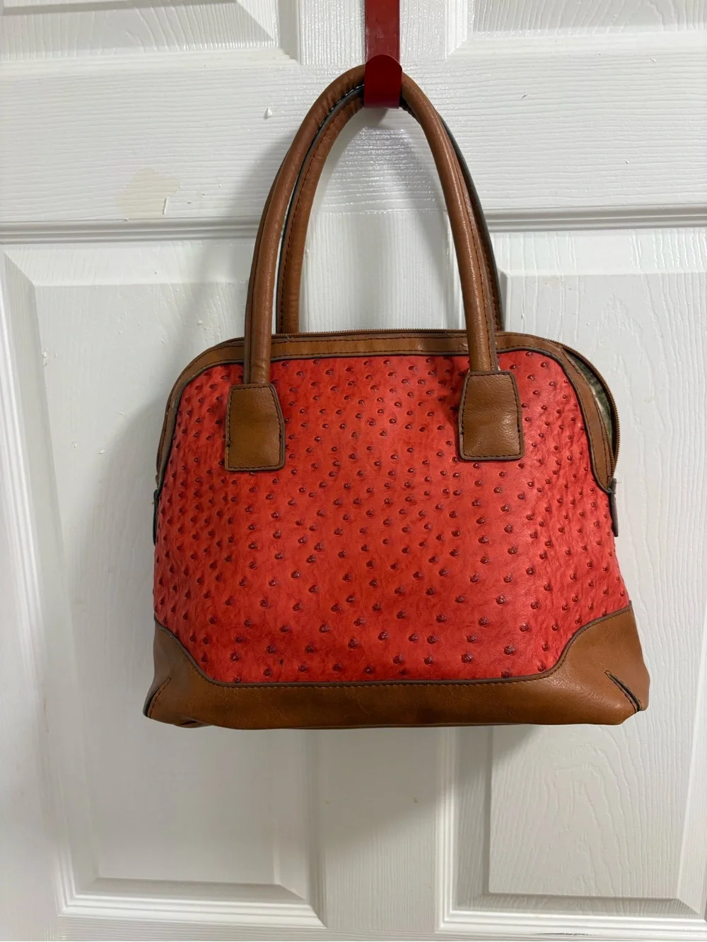 London Fog satchel features a distinctive red ostrich print and lock& key